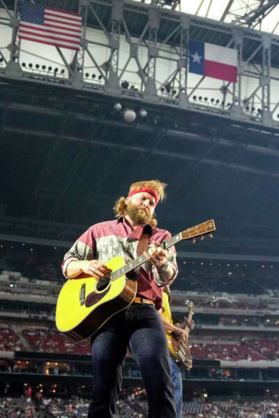 singer holding guitar